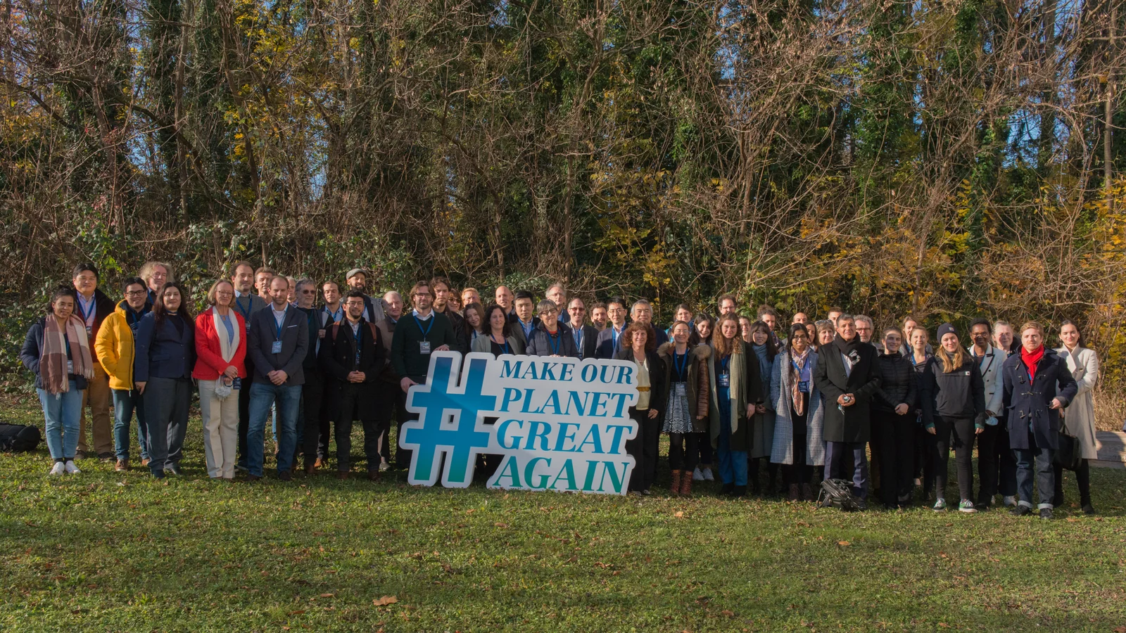 The MOPGA laureates' group photo, in front of the Make Our Planet Great Again sign