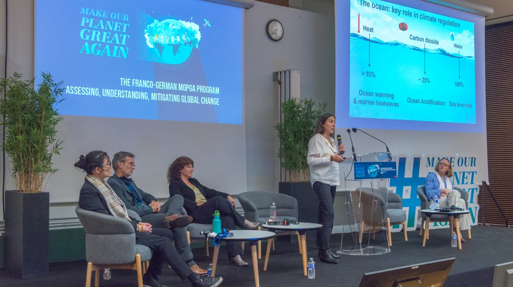 A talk in plenary, in front of the panel