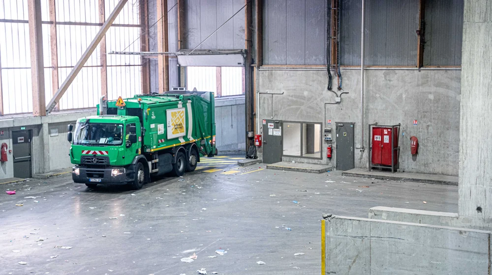A collection truck in the empty hall