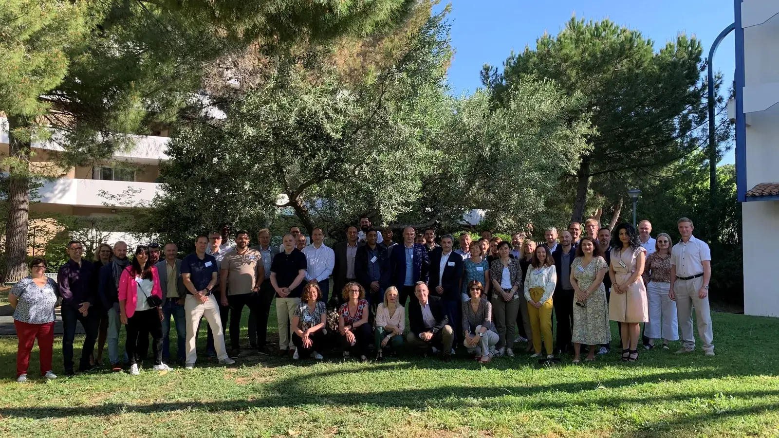 Group photo of the participants in the hotel garden